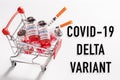 shopping cart with vaccine vials bottles for COVID-19 Delta vaccination Royalty Free Stock Photo