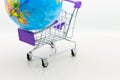 Shopping cart with world map for retail business. Image use for online and offline shopping, marketing place world wide, business