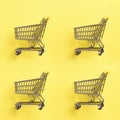 Shopping cart on yellow background. Minimalism style. Creative design. Top view with copy space. Shop trolley at supermarket. Sale Royalty Free Stock Photo