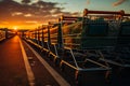 Shopping carts are lined up in the parking lot of supermarket against the backdrop of beautiful sunset. Royalty Free Stock Photo