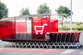 shopping carts lined up in the parking lot of a supermarket Royalty Free Stock Photo