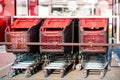 shopping carts lined up in the parking lot of a supermarket Royalty Free Stock Photo