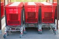 shopping carts lined up in the parking lot of a supermarket Royalty Free Stock Photo