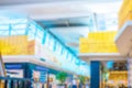 Shopping center building blurred background. People shopping in modern commercial mall center. Interior of retail centre store in Royalty Free Stock Photo