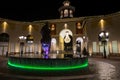 Shopping center by night with the green light fountain with the horse head, Italy Royalty Free Stock Photo