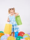 Shopping child. little girl holding shopping bags