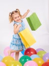 Shopping child. little girl holding shopping bags