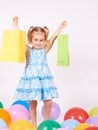 Shopping child. little girl holding shopping bags Royalty Free Stock Photo