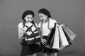 Shopping concept. Child cute small girls on shopping tour. Best price. Buy now. Visit shopping mall. Kids girls hold Royalty Free Stock Photo