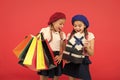 Shopping concept. Child cute small girls on shopping tour. Best price. Buy now. Visit shopping mall. Kids girls hold Royalty Free Stock Photo