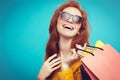 Shopping Concept - Close up Portrait young beautiful attractive redhair girl smiling looking at camera with shopping bag Royalty Free Stock Photo