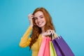 Shopping Concept - Close up Portrait young beautiful attractive redhair girl smiling looking at camera with shopping bag Royalty Free Stock Photo