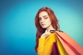 Shopping Concept - Close up Portrait young beautiful attractive redhair girl smiling looking at camera with shopping bag Royalty Free Stock Photo