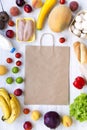 Shopping concept. Set of various groceries with paper bag on white wooden table, top view. Cooking food background. Flat lay of fr Royalty Free Stock Photo