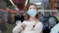 Shopping on coronavirus, woman buyer wearing a mask and gloves while shopping in quarantine because of a coronavirus in