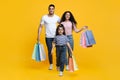 Shopping Day. Cheerful Young Middle-Eastern Family Of Three Walking With Shopper Bags Royalty Free Stock Photo