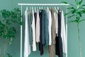 Shopping dress clothes shelf green leaves plant background Royalty Free Stock Photo