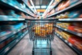 Shopping experience Blurred shopping cart in a busy supermarket department store