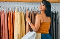 Shopping, fashion and smile, woman at designer clothing boutique with bag and happy face. Retail therapy, customer