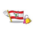 Shopping flag lebanon raised above mascot pole