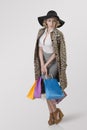 Shopping girl with hat and leopard coat Royalty Free Stock Photo