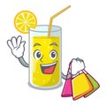 Shopping glass fresh lemon juice on mascot Royalty Free Stock Photo