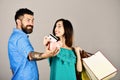 Shopping and leisure concept. Man with beard holds credit card