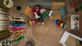 Top view close up shot of young girl on the couch in the living room, female holding clothes she ordered online, box and Royalty Free Stock Photo