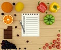 Shopping list. Different vegetables and fruit with notebook with blank pages to write your text. Royalty Free Stock Photo