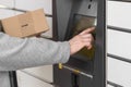 Shopping locker inPost with woman hand entering code to open it. Caption: Read the QR code here and pick it up faster. Royalty Free Stock Photo