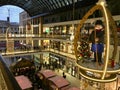 Shopping `Mall of Berlin` decorated for Christmas, busy with many Shoppers and illuminated with thousands of lights Royalty Free Stock Photo