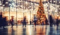 A shopping mall decorated for christmas with a large illuminated Christmas tree and busy shoppers Royalty Free Stock Photo