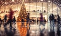 A shopping mall decorated for christmas with a large illuminated Christmas tree and busy shoppers