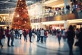 Shopping mall decorated for Christmas time. Crowd of people looking for presents and preparing for the holidays Royalty Free Stock Photo