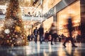 Shopping mall decorated for Christmas time. Crowd of people looking for presents and preparing for the holidays Royalty Free Stock Photo