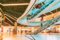 Shopping mall interior blurred background. People shopping in modern commercial mall center. Interior of retail centre store in Royalty Free Stock Photo