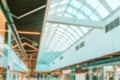 Shopping mall people blurred background. People shopping in modern commercial mall center. Interior of retail centre store in soft Royalty Free Stock Photo