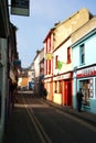 Shopping in a narrow street in Kinsale, County Cork, Ireland on the 18th March. Small shops in a small town Royalty Free Stock Photo