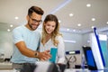 Shopping a new digital device. Happy couple buying a smartphone in store. Royalty Free Stock Photo