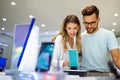 Shopping a new digital device. Happy couple buying a smartphone in store. Royalty Free Stock Photo