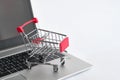 Shopping noline. Buying cart on keyboard of the laptop