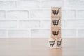 Shopping online concept, Shopping cart icons on cubes on wooden background Royalty Free Stock Photo