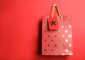 Shopping paper bag with star pattern on background, space for text Royalty Free Stock Photo