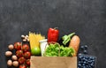 Shopping in a paper bag: vegetables, milk, berries, nuts..Food delivery. Advertising