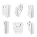 Shopping paper bags realistic mockups set. White blank packaging with rope handles templates. Royalty Free Stock Photo