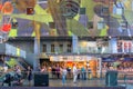 Shopping people inside the beautiful artistic and colorful market hall of Rotterdam, the Netherlands.