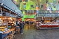 Shopping people inside the beautiful artistic and colorful market hall of Rotterdam, the Netherlands.