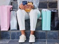 Shopping, phone and retail woman on stairs online relaxing with store gifts, choice and purchase. Present, sale and Royalty Free Stock Photo