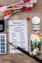 Shopping receipts with pills, calculator Royalty Free Stock Photo