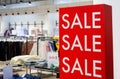 Shopping Sale background. Signage Sale in a clothing store. Royalty Free Stock Photo